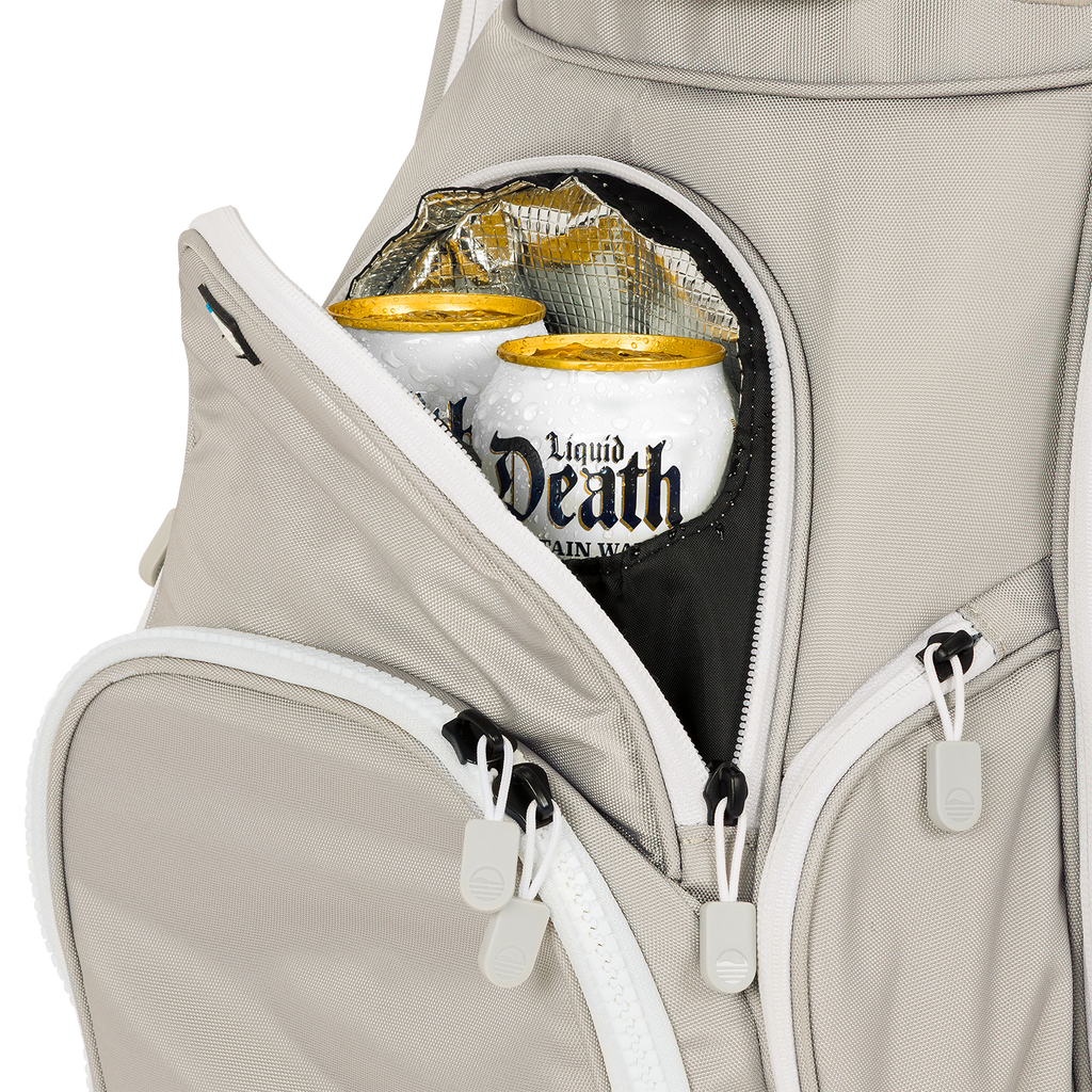 A close up shot of Cool Gray Big Rig golf bag's frosty pocket with canned drinks inside
