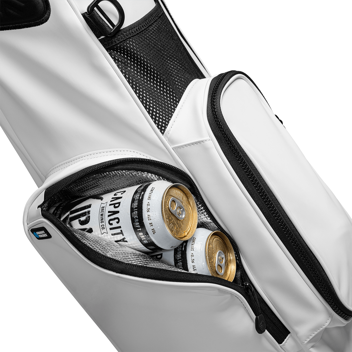A close up shot of El Camino S-Class golf bag in white vegan leather showing off its frosty pocket with canned drinks inside