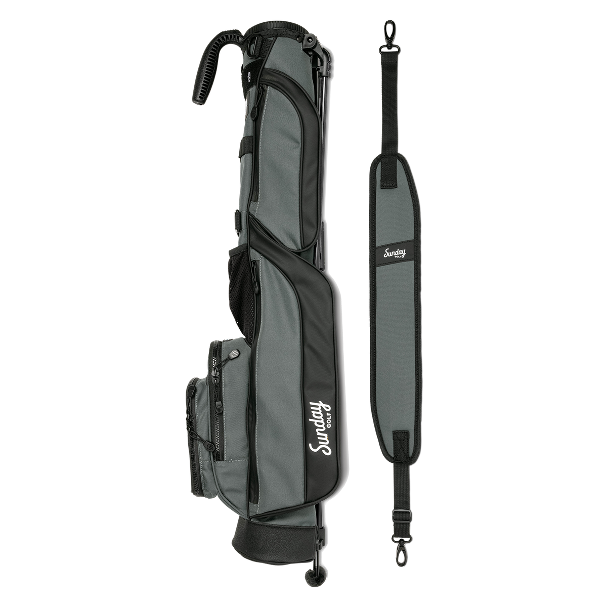 A full shot of Loma golf bag in midnight green laying flat sideways beside its single strap