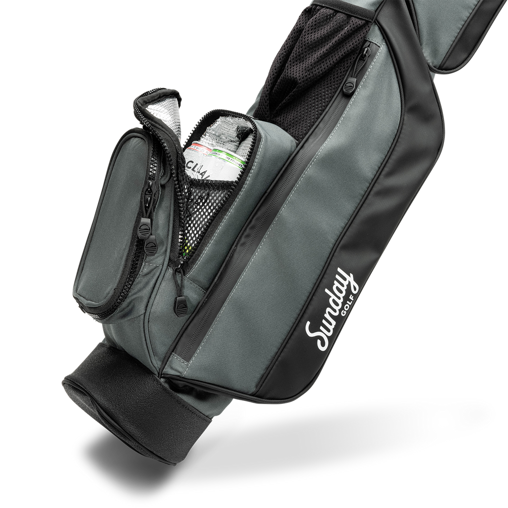A close up shot of midnight green leather Loma golf bag's insulated pocket with canned drinks inside