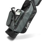 A close up shot of midnight green leather Loma golf bag's insulated pocket with canned drinks inside