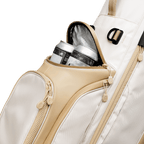 A close up shot of toasted almond Ryder golf bag's frosty pocket with canned drinks inside